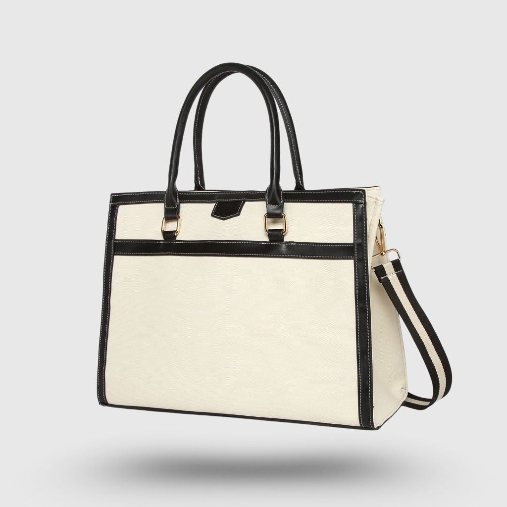 Close-up of tote bag zip pocket and metallic hardware detail